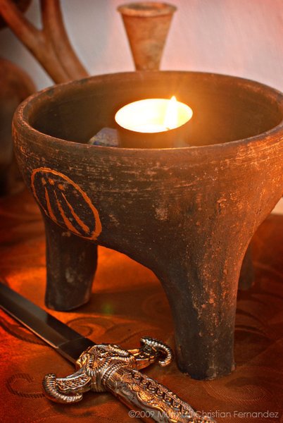 oggun santeria cauldron filled with water meanung